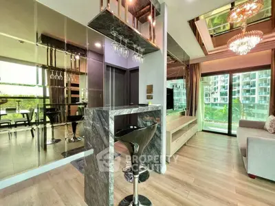 Luxurious modern living room with elegant bar and stunning balcony view.