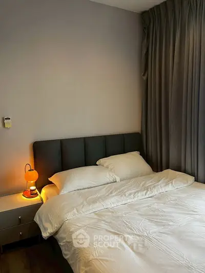 Cozy bedroom with modern decor and warm lighting