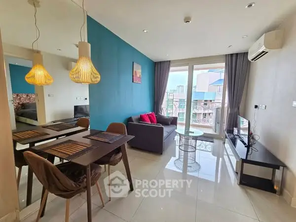 Modern living room with dining area, stylish lighting, and balcony view in urban apartment.