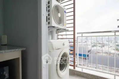 Modern balcony with washing machine and city view, perfect for urban living convenience.