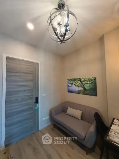 Cozy living room with modern chandelier and stylish decor