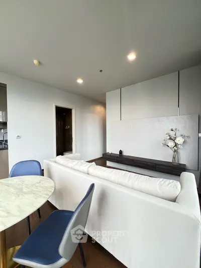 Modern living room with elegant decor and marble dining table