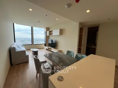 Spacious living room with stunning city view and modern furniture