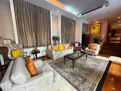 Luxurious living room with elegant decor and plush seating in a sophisticated home setting.