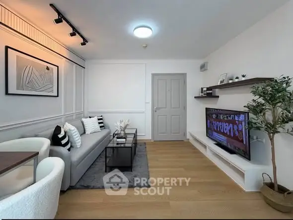 Modern living room with stylish decor and sleek furniture, perfect for relaxation and entertainment.