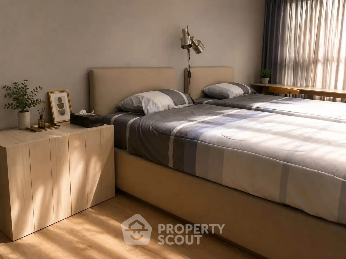 Cozy bedroom with modern decor and natural light, featuring a stylish bed and wooden nightstand.