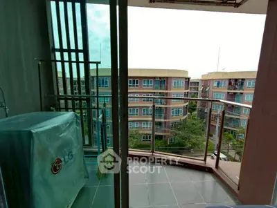 Spacious balcony with city view in modern apartment complex