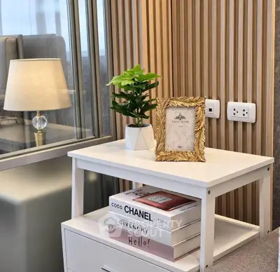 Stylish modern interior with elegant decor and designer books on a sleek white table.