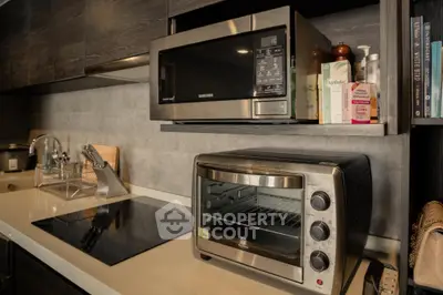 Modern kitchen with sleek appliances and stylish countertop