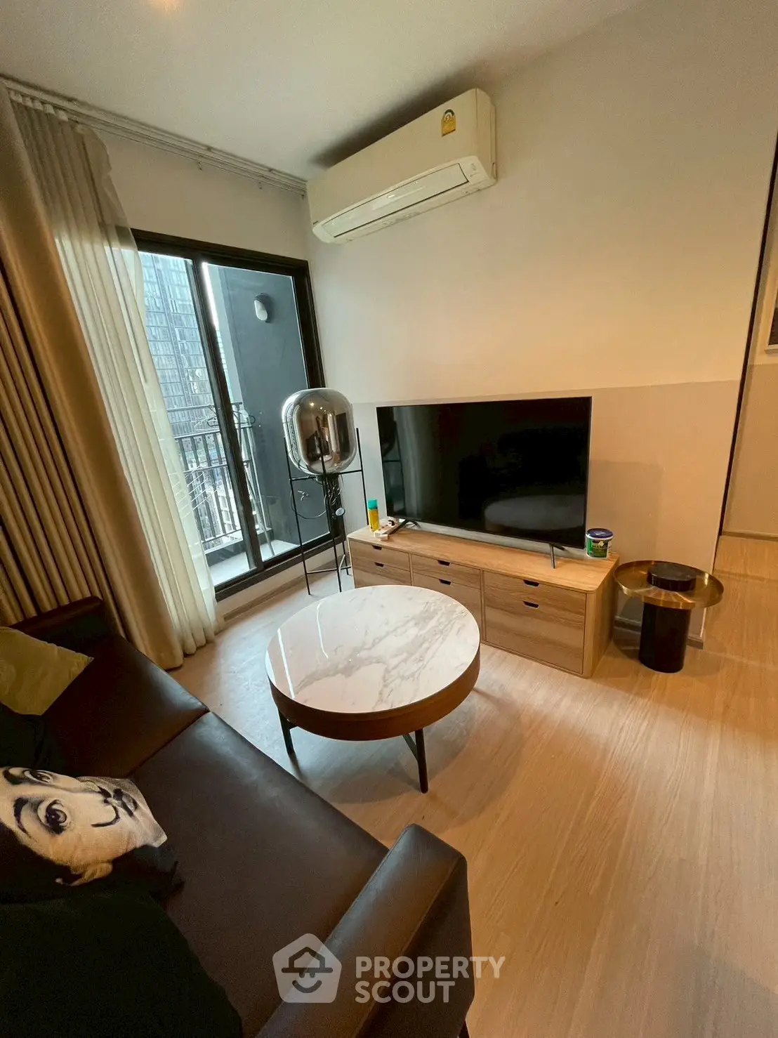 Modern living room with balcony access and sleek furniture