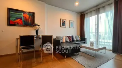 Stylish living room with modern decor and large windows for natural light.