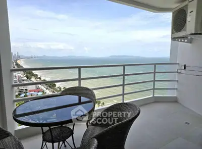 Stunning beachfront balcony with panoramic ocean views and modern outdoor seating.