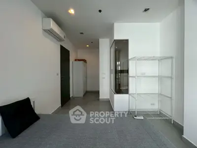 Modern minimalist bedroom with air conditioning and sleek storage solutions