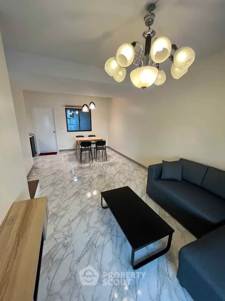 Modern living room with marble flooring and stylish lighting