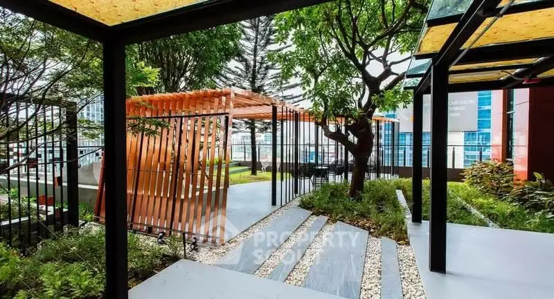 Modern outdoor garden area with stylish pergola and lush greenery in urban setting.