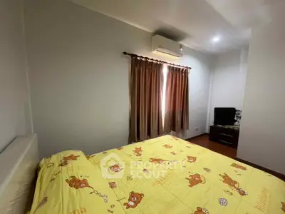 Cozy bedroom with air conditioning and charming decor, perfect for relaxation.