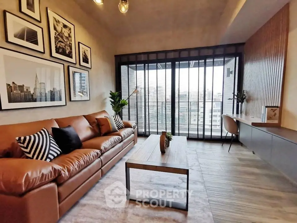 Stylish modern living room with leather sofa and city view, perfect for urban living.