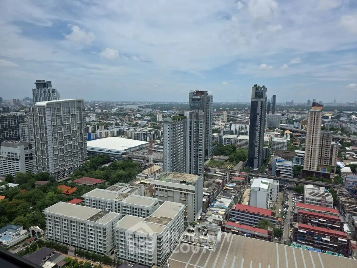 Stunning cityscape view from high-rise building showcasing urban skyline and modern architecture.