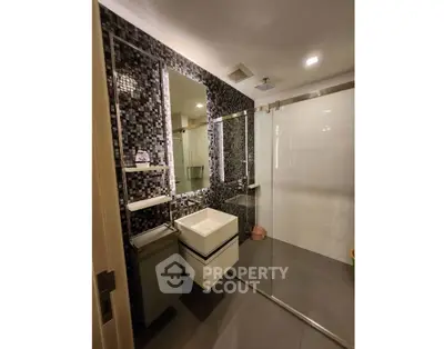 Modern bathroom with sleek design and glass shower enclosure