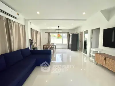 Spacious modern living room with elegant decor and ample natural light