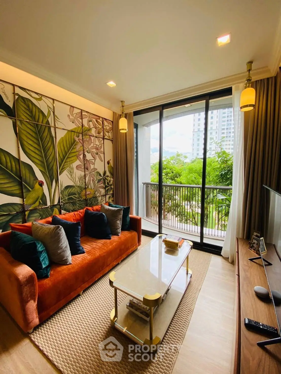 Stylish living room with vibrant decor and balcony view in modern apartment