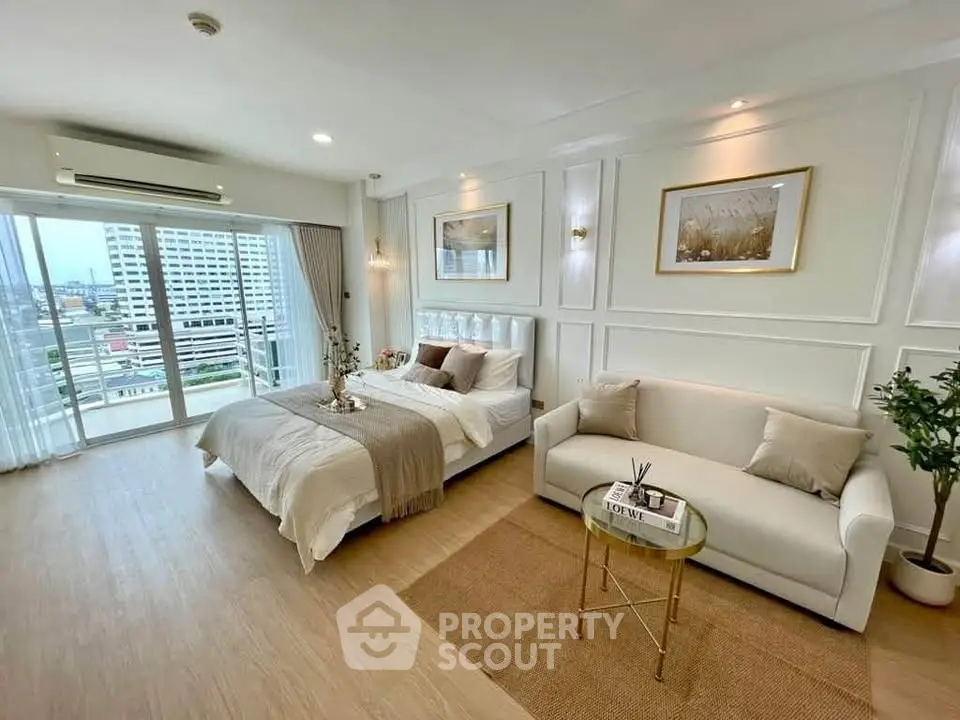 Spacious modern bedroom with city view and elegant decor