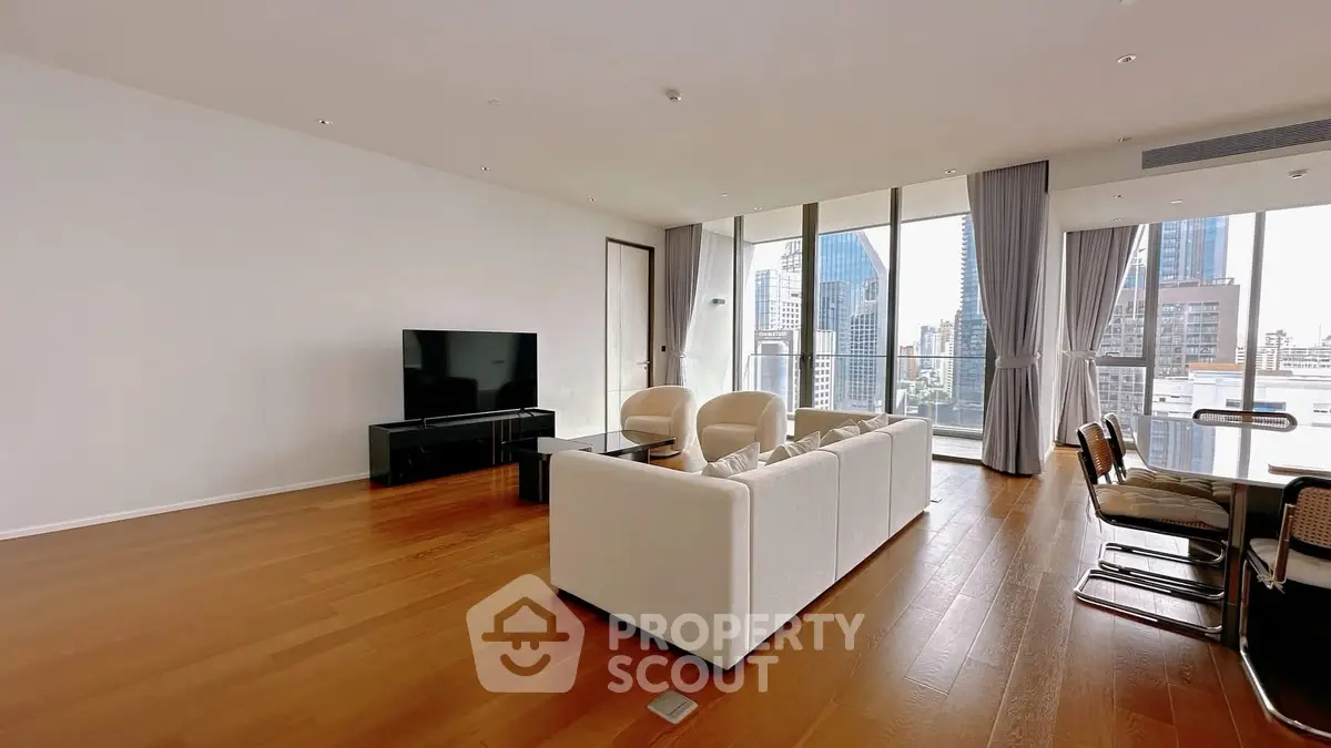 Spacious modern living room with city view and elegant furnishings