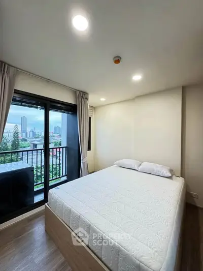 Modern bedroom with balcony view in urban apartment