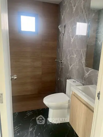 Modern bathroom with elegant marble tiles and sleek fixtures
