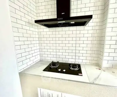 Modern kitchen with sleek gas stove and stylish subway tile backsplash