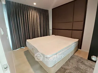 Cozy bedroom with modern design and elegant curtains