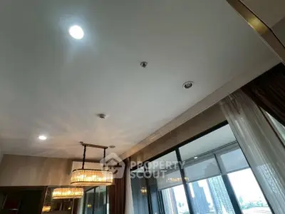 Luxurious high-rise apartment with elegant lighting and city view balcony.