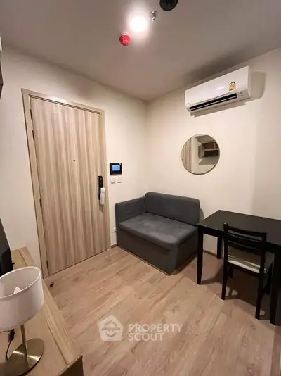 Cozy modern living room with air conditioning and minimalist furniture