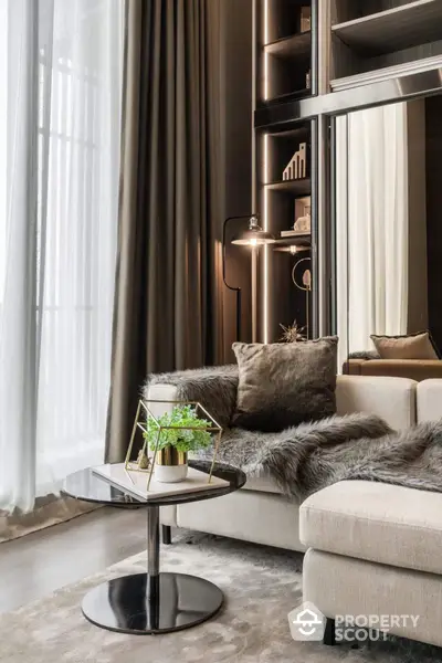 Luxurious living room with plush furnishings, elegant drapery, and sophisticated shelving, exuding a warm, inviting ambiance perfect for upscale urban living.