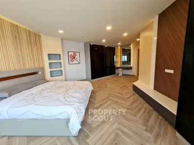 Spacious modern bedroom with elegant decor and stylish flooring