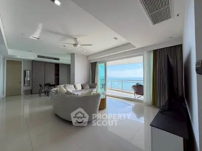 Spacious living room with ocean view and modern furnishings