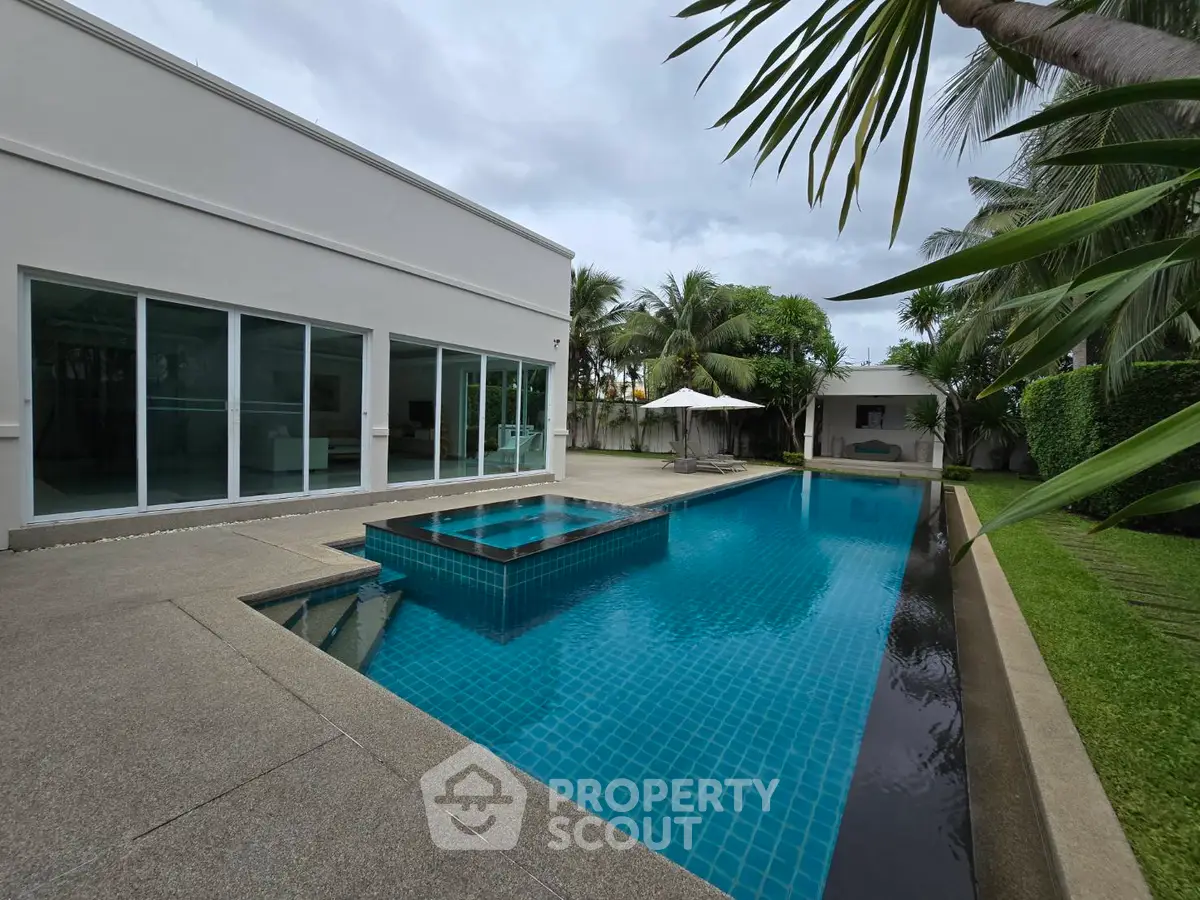 Luxurious modern villa with private pool and lush garden