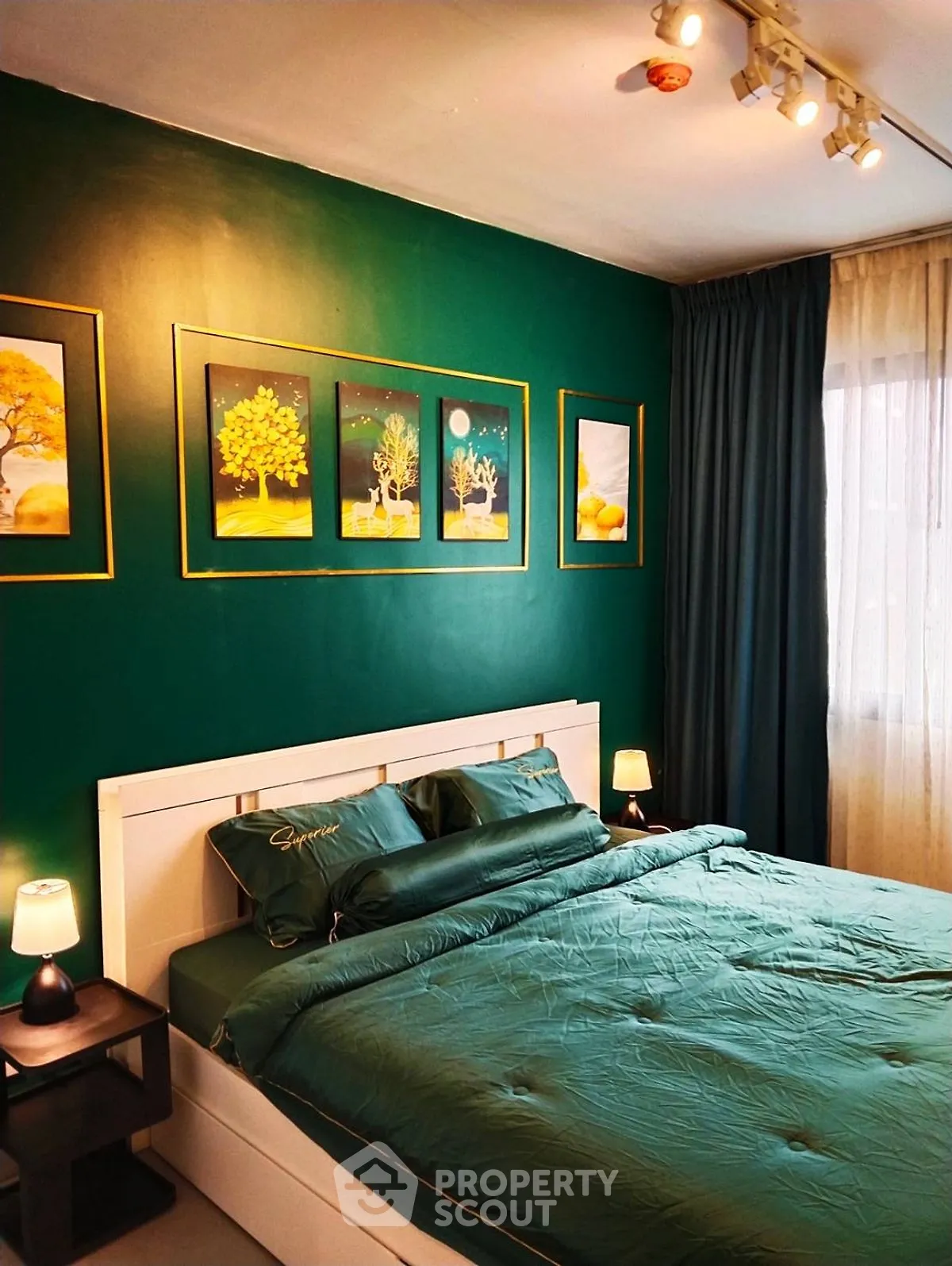 Stylish bedroom with green accent wall and modern decor