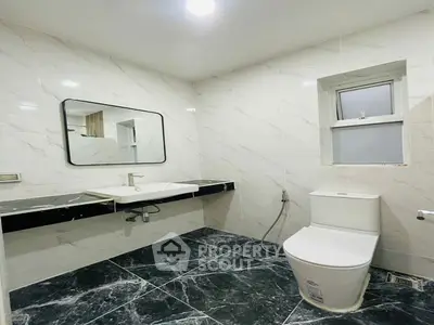 Modern bathroom with sleek design and marble flooring