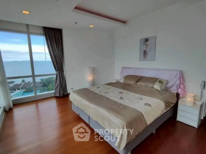 Spacious bedroom with stunning sea view and elegant decor