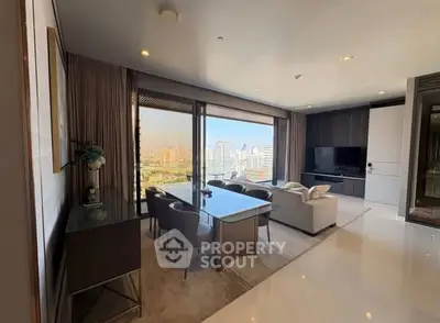 Luxurious living room with stunning city view, modern furniture, and elegant decor in high-rise apartment.