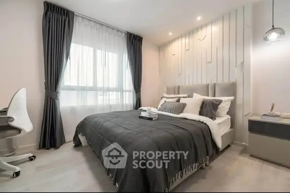 Modern bedroom with stylish decor and ample natural light