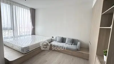 Modern minimalist bedroom with built-in storage and large window