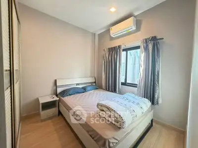 Cozy bedroom with modern air conditioning and natural light