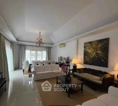 Spacious modern living room with elegant decor and ample natural light