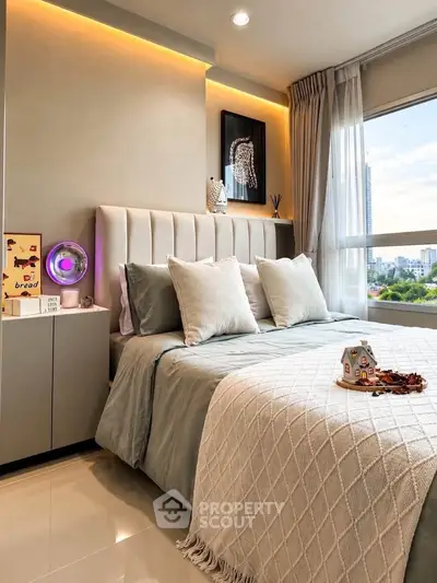 Luxurious bedroom with elegant decor and city view, featuring plush bedding and ambient lighting.