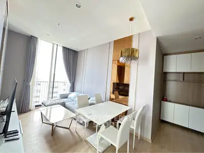 Modern living room with elegant dining area and natural light