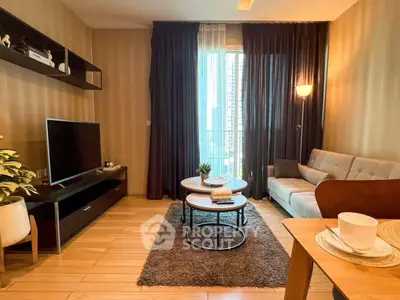 Modern living room with stylish decor and large window view in urban apartment.