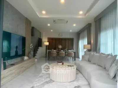 Spacious modern living room with elegant decor and large windows