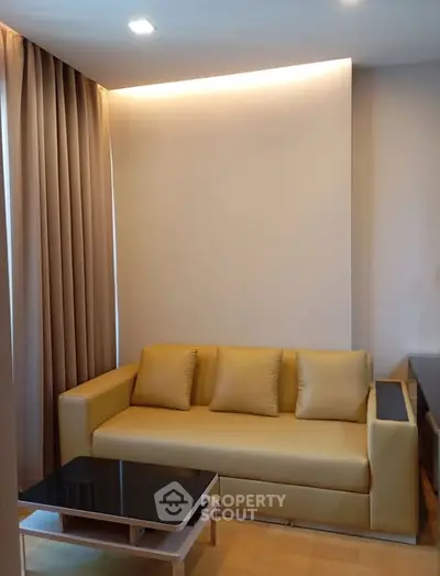 Modern living room with stylish yellow sofa and sleek coffee table
